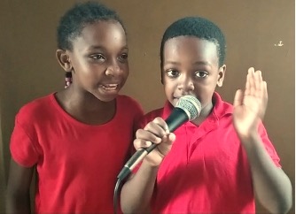 cathy and junior in red singing.jpg